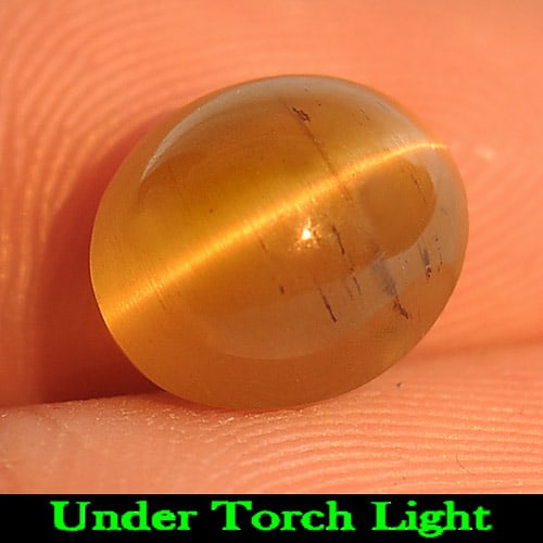 Natural Greenish Yellow Cat Eye Apatite 3.46 Ct. Oval Cabochon Shape 9.3 x 8 Mm. Gemstone: Product ID: 800612216 Product Name: Natural Apatite Weight: 3.46 CT. Size: 9.3 x 8 x 5.7 MM. Shape: Oval Cabochon Color: Greenish Yellow Clarity:Semi - Transparent Luster: Good Gems Origin: Tanzania T