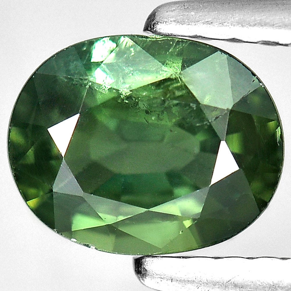 Natural Green Sapphire 1.03 Ct. Oval Shape 6.9 x 5.5 Mm. Gemstone From Thailand: Product ID: 806130634 Product Name: Natural Green Sapphire Weight: 1.03 CT. Size: 6.9 x 5.5 x 3.1 MM. Shape: Oval Color: Green Clarity:SI1 Luster: Good Gems Origin: Thailand Treatment: Heated Crystal 