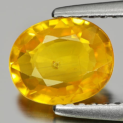 Natural Yellow Sapphire 1.32 Ct. Oval Shape 7.1 x 6.2 Mm. Gemstone From Thailand: Product ID: 806151080 Product Name: Natural Yellow Sapphire Weight: 1.32 CT. Size: 7.1 x 6.2 x 2.9 MM. Shape: Oval Color: Yellow Clarity:SI1 Luster: Good Gems Origin: Thailand Treatment: Heated Crysta