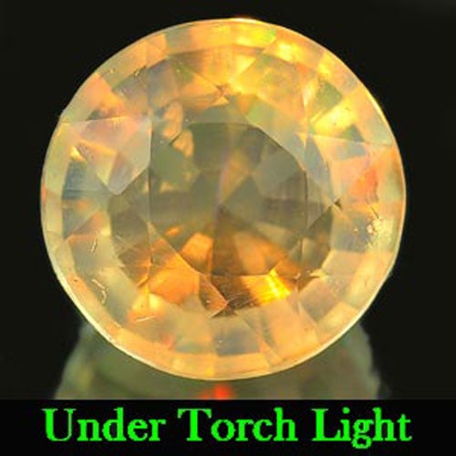 Natural Unheated Multi Color Opal 1.85 Ct. Round Shape 8.6 Mm. Gemstone: Product ID: 818711808 Product Name: Natural Opal Weight: 1.85 CT. Size: 8.6 x 8.6 x 5.7 MM. Shape: Round Color: Multi Color Clarity:Semi - Transparent Luster: Iridescent Gems Origin: Ethiopia Treatmen