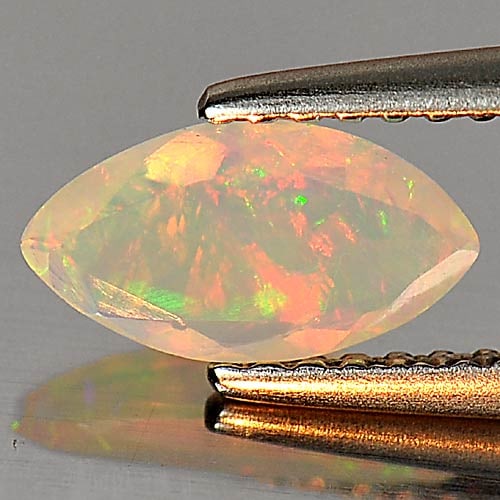 Natural Multi Color Play Of Colour Opal 0.38 Ct. Marquise Shape 8.9 x 4.8 Mm Gemstone From Ethiopia: Product ID: 818726190 Product Name: Natural Opal Weight: 0.38 CT. Size: 8.9 x 4.8 x 2.6 MM. Shape: Marquise Color: Multi Color Clarity:Semi - Transparent Luster: Iridescent Gems Origin: Ethiopia Treat
