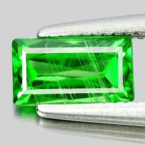 Natural Green Tsavorite Garnet 0.71 Ct. Octagon Shape 6.8 x 3.8 Mm. Gemstone From Tanzania: Product ID: 803002527 Product Name: Natural Tsavorite Weight: 0.71 CT. Size: 6.8 x 3.8 x 2.6 MM. Shape: Octagon Color: Green Clarity:SI1 Luster: Good Gems Origin: Tanzania Treatment: Unheated Crystal