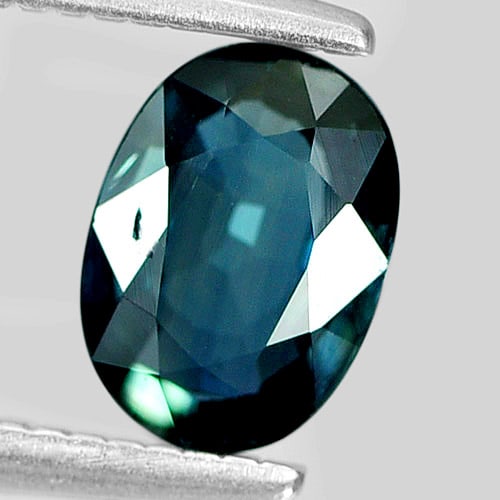 Natural Greenish Blue Sapphire 0.73 Ct. Oval Shape 6.6 x 4.7 Mm. Gemstone From Thailand: Product ID: 806158760 Product Name: Natural Green Sapphire Weight: 0.73 CT. Size: 6.6 x 4.7 x 2.5 MM. Shape: Oval Color: Greenish Blue Clarity:VSI Luster: Good Gems Origin: Thailand Treatment: Heated 