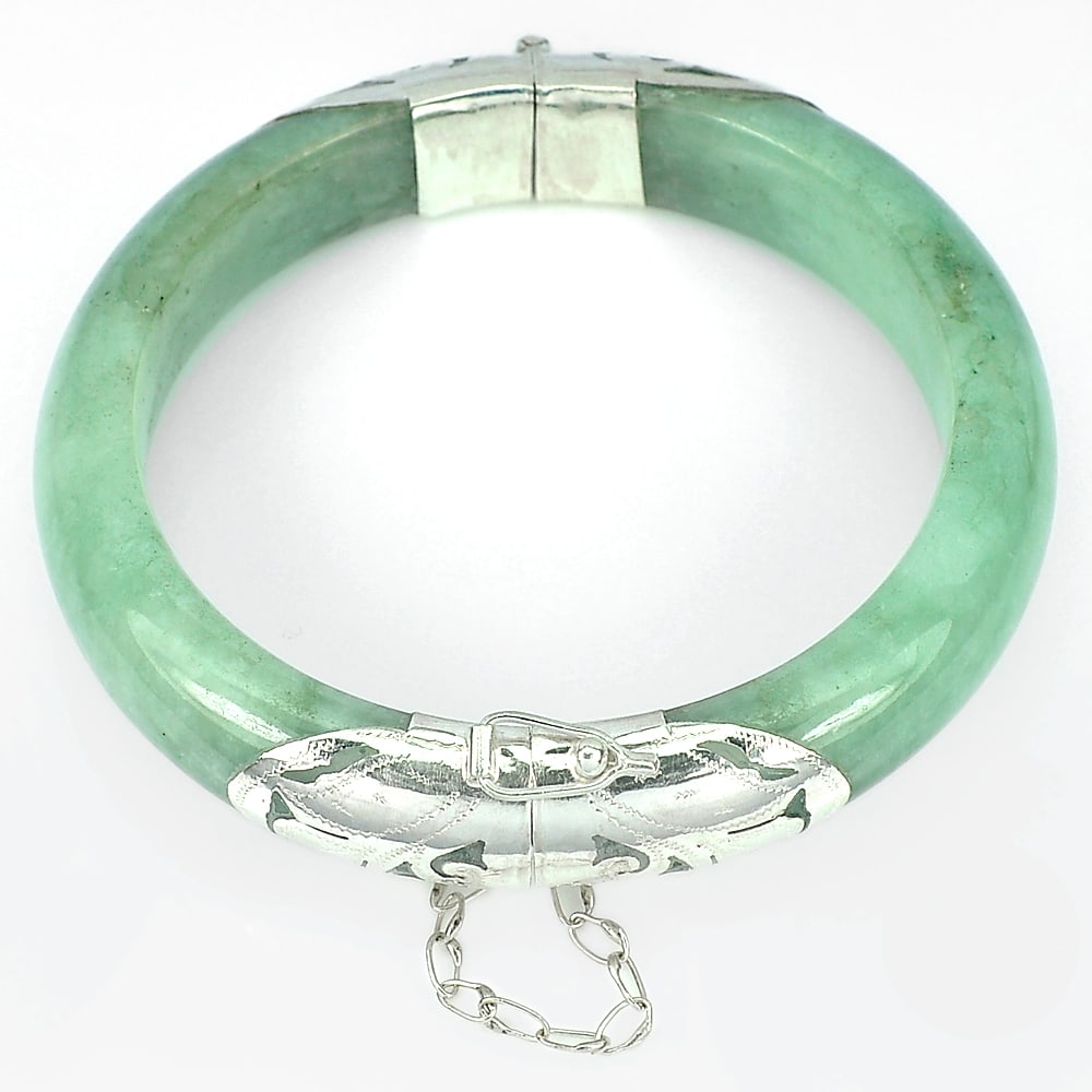 Natural Green Jade 345.55 Ct. Bangle Jewelry with Silver Diameter 61 mm.: Product ID: 819813194 Product Name: Natural Jade Weight: 345.55 CT. Size: 76 x 61 x 15 MM. Shape: Round Cabochon Color: Green Clarity:Opaque Luster: Good Gems Origin: Thailand Treatment: Unheated Crys