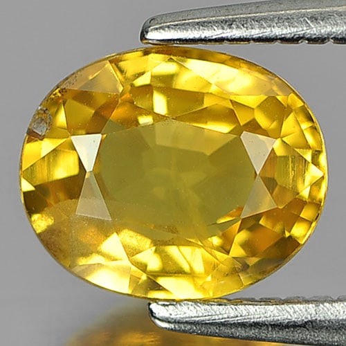 Natural Yellow Sapphire 1.33 Ct. Oval Shape 7.2 x 6 Mm. Gemstone From Thailand: Product ID: 806153024 Product Name: Natural Yellow Sapphire Weight: 1.33 CT. Size: 7.2 x 6 x 3.4 MM. Shape: Oval Color: Yellow Clarity:SI Luster: Good Gems Origin: Thailand Treatment: Heated Crystal S