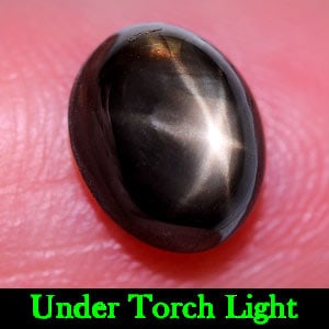 Natural Black Star Sapphire 6 Rays 2.77 Ct. Oval Cabochon Shape 8.5 x 6.8 Mm. Gemstone From Thailand: Product ID: 806135975 Product Name: Natural Star Sapphire Weight: 2.77 CT. Size: 8.5 x 6.8 x 4.3 MM. Shape: Oval Cabochon Color: Black Clarity:Opaque Luster: Good 6 Rays Star Gems Origin: Thailand Tre