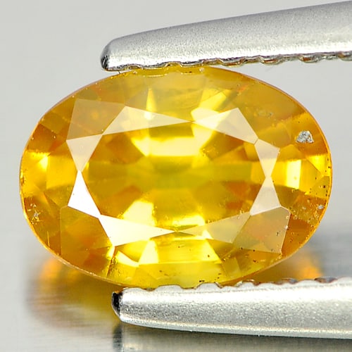 Natural Yellow Sapphire 0.85 Ct. Oval Shape 6.8 x 4.9 Mm. Gemstone From Thailand: Product ID: 806129909 Product Name: Natural Yellow Sapphire Weight: 0.85 CT. Size: 6.8 x 4.9 x 3.2 MM. Shape: Oval Color: Yellow Clarity:SI Luster: Good Gems Origin: Bangkaja, Thailand Treatment: Heat