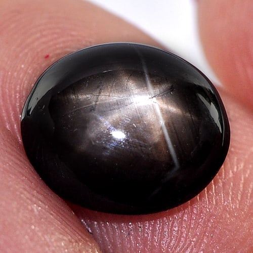 Natural Black Star Sapphire 4.41 Ct. Oval Cabochon Shape 10.8 x 9 Mm. Gemstone From Thailand: Product ID: 806134873 Product Name: Natural Star Sapphire Weight: 4.41 CT. Size: 10.8 x 9 x 4 MM. Shape: Oval Cabochon Color: Black Clarity:Opaque Luster: Good 6 Rays Star Gems Origin: Thailand Treatm