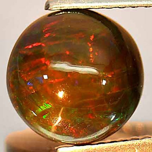 Natural Multi-Color Opal 1.89 Ct. Round Cabochon Shape 9.2 Mm. Gemstone Unheated From Ethiopia: Product ID: 818725648 Product Name: Natural Opal Weight: 1.89 CT. Size: 9.2 x 9.2 x 4.7 MM. Shape: Round Cabochon Color: Multi-Color Clarity:Opaque Luster: Iridescent Gems Origin: Ethiopia Treatment: 
