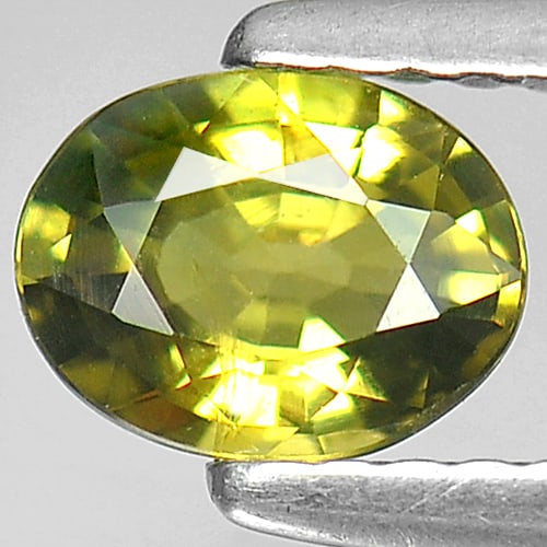 Natural Yellow Green Sapphire 0.71 Ct. Oval Shape 6.2 x 4.8 Mm. Gemstone From Thailand: Product ID: 806150329 Product Name: Natural Yellow Sapphire Weight: 0.71 CT. Size: 6.2 x 4.8 x 2.9 MM. Shape: Oval Color: Yellow Green Clarity:SI1 Luster: Good Gems Origin: Thailand Treatment: Heated 