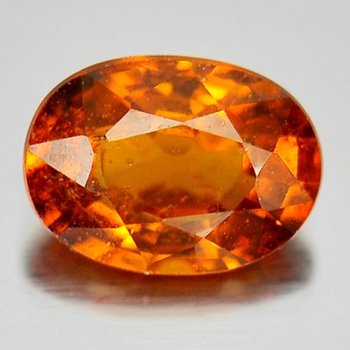 Natural Reddish Orange Spessartine Garnet 0.85 Ct. Oval Shape 6.6 x 4.9 Mm Gemstone From Nigeria: Product ID: 802921019 Product Name: Natural Spessartine Weight: 0.85 CT. Size: 6.6 x 4.9 x 3.3 MM. Shape: Oval Color: Reddish Orange Clarity:SI Luster: Good Gems Origin: Nigeria Treatment: Unheated Cr