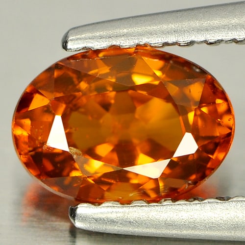 Natural Orange Spessartine Garnet 0.89 Ct. Oval Shape 6.7 x 4.9 Mm Gemstone From Nigeria: Product ID: 802921441 Product Name: Natural Spessartine Weight: 0.89 CT. Size: 6.7 x 4.9 x 3.5 MM. Shape: Oval Color: Orange Clarity:SI Luster: Good Gems Origin: Nigeria Treatment: Unheated Crystal St