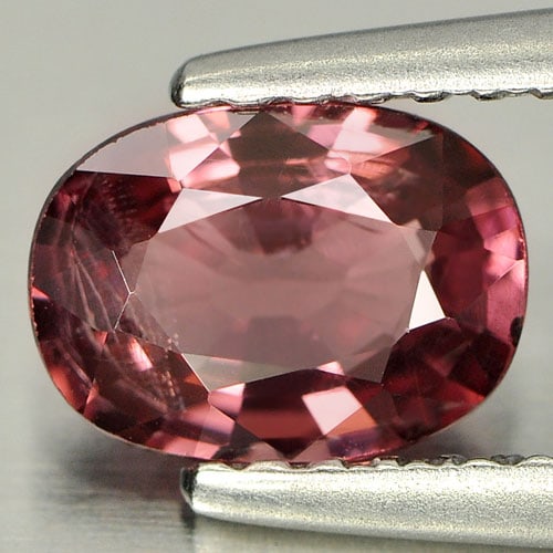 Natural Purplish Pink Rhodolite Garnet 0.94 Ct. Oval Shape 7.1 x 5.2 Mm Gemstone From Madagascar: Product ID: 802925090 Product Name: Natural Rhodolite Weight: 0.94 CT. Size: 7.1 x 5.2 x 3 MM. Shape: Oval Color: Purplish Pink Clarity:VVS Luster: Good Gems Origin: Madagascar Treatment: Unheated Cry