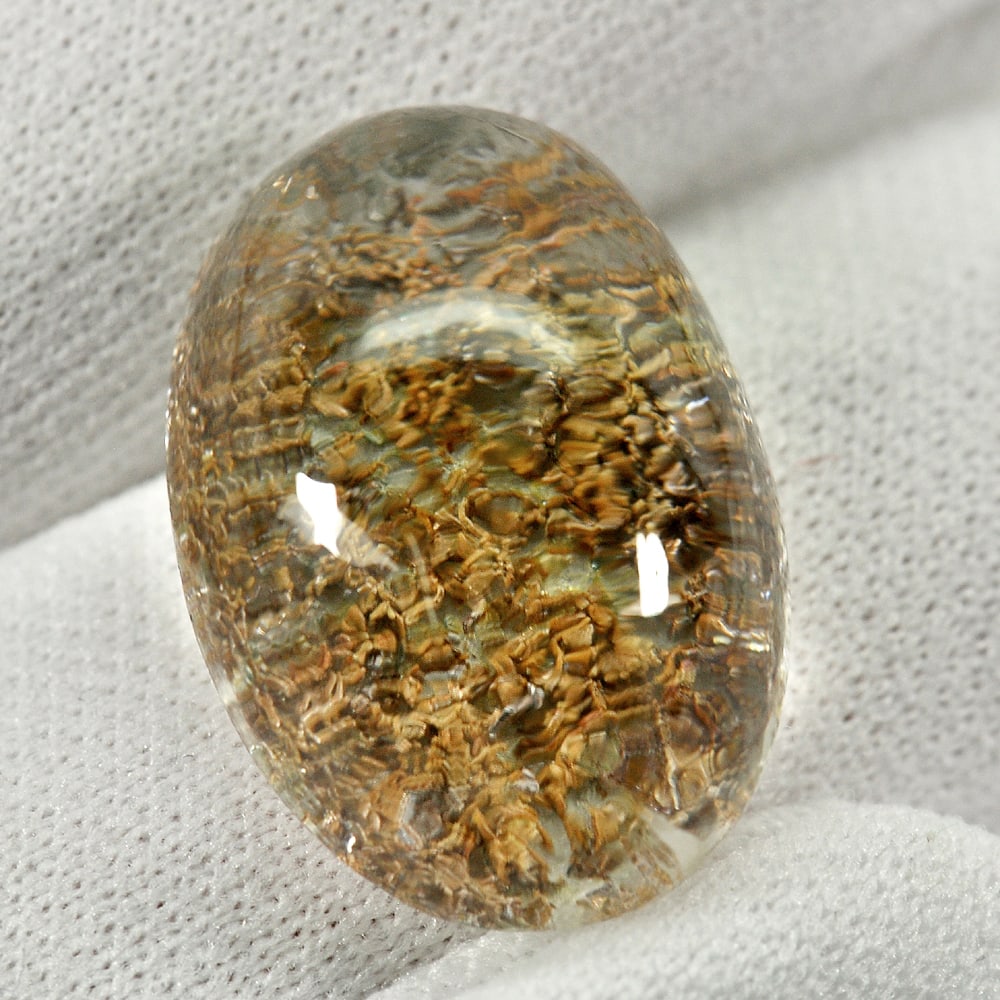 Natural Moss Quartz 22.40 Ct. Oval Cabochon Shape 21 x 14.8 Mm. Gemstone From Thailand: Product ID: 805529528 Product Name: Natural Quartz Weight: 22.40 CT. Size: 21 x 14.8 x 9.9 MM. Shape: Oval Cabochon Color: White Clarity:Semi - Transparent Luster: Good Gems Origin: Thailand Treatment