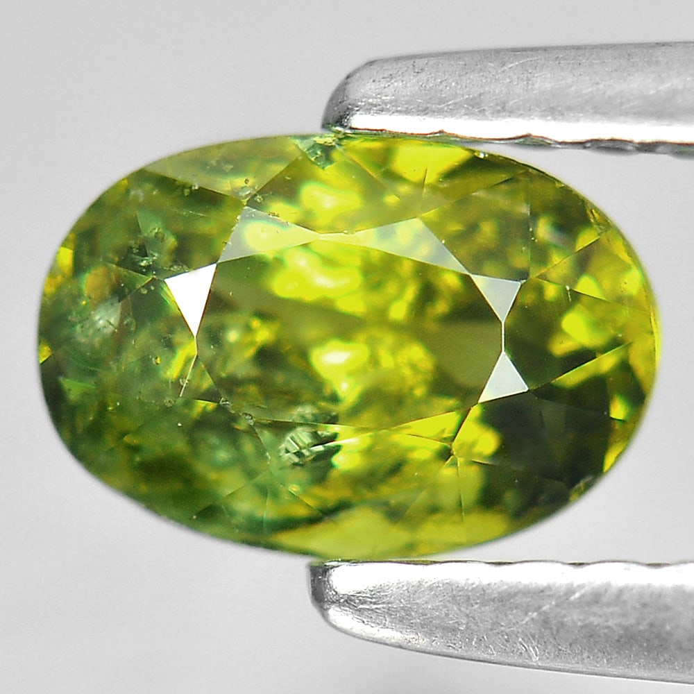 Natural Green Demantoid Garnet 0.95 Ct. Oval Shape 6.6 x 4.5 Mm. Gemstone From Madagascar: Product ID: 802924275 Product Name: Natural Demantoid Weight: 0.95 CT. Size: 6.6 x 4.5 x 3.6 MM. Shape: Oval Color: Green Clarity:SI1 Luster: Good Gems Origin: Mardagascar Treatment: Unheated Crystal 