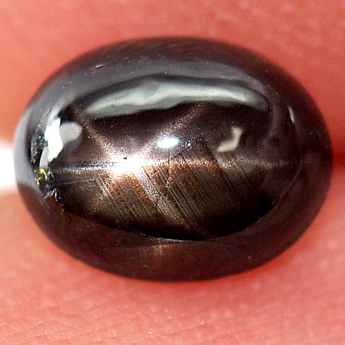 Natural Black Star Sapphire 6 Rays 0.91 Ct. Oval Cabochon Shape 6 x 4.6 Mm. Gemstone From Thailand: Product ID: 806132055 Product Name: Natural Star Sapphire Weight: 0.91 CT. Size: 6 x 4.6 x 3 MM. Shape: Oval Cabochon Color: Black Clarity:Opaque Luster: Good 6 Rays Star Gems Origin: Thailand Treatme