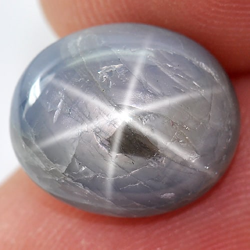 Natural Blue Star Sapphire 6 Rays 10.20 Ct. Oval Cabochon Shape 13 x 11.1 Mm Gemstone From Thailand: Product ID: 806149363 Product Name: Natural Star Sapphire Weight: 10.20 CT. Size: 13 x 11.1 x 6.7 MM. Shape: Oval Cabochon Color: Blue Clarity:Opaque Luster: Good 6 Rays Star Gems Origin: Thailand Tre