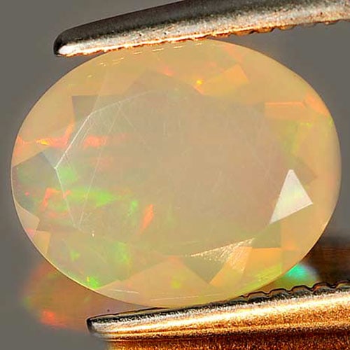 Natural Multi Color Opal 0.92 Ct. Oval Shape 9.1 x 7.4 Mm. Gemstone Unheated From Ethiopia: Product ID: 818725903 Product Name: Natural Opal Weight: 0.92 CT. Size: 9.1 x 7.4 x 3.8 MM. Shape: Oval Color: Multi Color Clarity:Semi - Transparent Luster: Iridescent Gems Origin: Ethiopia Treatment