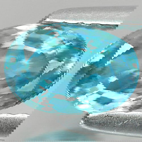 Natural Blue Zircon 1.33 Ct. Oval Shape 7.1 x 4.8 Mm Gemstone From Cambodia: Product ID: 807722303 Product Name: Natural Zircon Weight: 1.33 CT. Size: 7.1 x 4.8 x 3.5 MM. Shape: Oval Color: Blue Clarity:VVS Luster: Good Gems Origin: Cambodia Treatment: Heated Crystal Structure