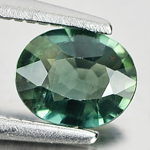Natural Bluish Green Sapphire 0.59 Ct. Oval Shape 6 x 4.8 Mm. Gemstone From Thailand: Product ID: 806154660 Product Name: Natural Green Sapphire Weight: 0.59 CT. Size: 6 x 4.8 x 2.5 MM. Shape: Oval Color: Bluish Green Clarity:VSI Luster: Good Gems Origin: Tanzania Treatment: Heated Cry