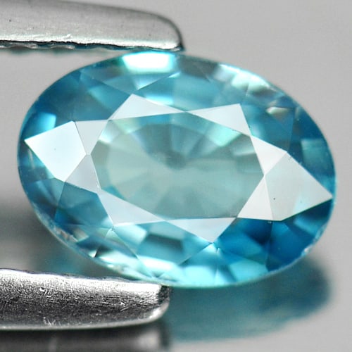 Natural Blue Zircon 0.88 Ct. Oval Shape 6.9 x 5 Mm. Gemstone From Cambodia: Product ID: 807711170 Product Name: Natural Zircon Weight: 0.88 CT. Size: 6.9 x 5 x 2.9 MM. Shape: Oval Color: Blue Clarity:VSI Luster: Good Gems Origin: Cambodia Treatment: Heated Crystal Structure: