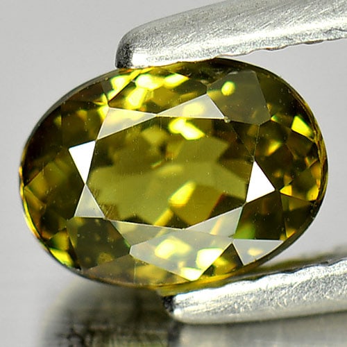 Natural Demantoid Garnet 1.21 Ct. VVS Oval Shape 6.9 x 5.2 Mm. Unheated Gemstone From Madagascar: Product ID: 802931372 Product Name: Natural Demantoid Weight: 1.21 CT. Size: 6.9 x 5.2 x 3.7 MM. Shape: Oval Color: Greenish Yellow Clarity:VVS Luster: Very Good Gems Origin: Madagascar Treatment: Unh