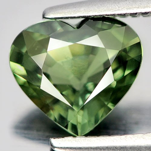 Natural Green Sapphire 0.96 Ct. VVS Heart Shape 6.8 x 6 Mm. Gemstone From Thailand: Product ID: 806146405 Product Name: Natural Green Sapphire Weight: 0.96 CT. Size: 6.8 x 6 x 3 MM. Shape: Heart Color: Green Clarity:VVS Luster: Very Good Gems Origin: Thailand Treatment: Heated Crysta