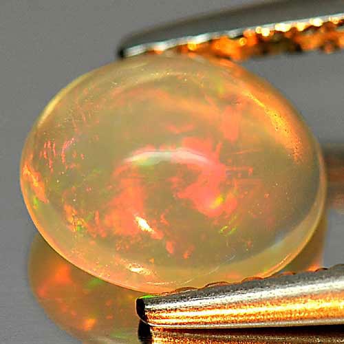 Natural Multi Color Opal 0.79 Ct. Oval Cabochon Shape 7.4 x 6.5 Mm. Unheated Gemstone: Product ID: 818726007 Product Name: Natural Opal Weight: 0.79 CT. Size: 7.4 x 6.5 x 3.9 MM. Shape: Oval Cabochon Color: Multi Color Clarity:Opaque Luster: Iridescent Gems Origin: Ethiopia Treatment: U