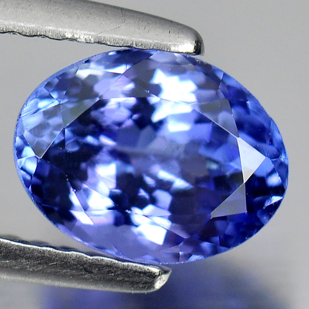 Natural Violetish Blue Tanzanite 1.73 Ct. Oval Shape 8 x 6.2 Mm. Gemstone From Tanzania: Product ID: 807009057 Product Name: Natural Tanzanite Weight: 1.73 CT. Size: 8 x 6.2 x 4.7 MM. Shape: Oval Color: Violetish Blue Clarity:VVS Luster: Good Gems Origin: Tanzania Treatment: Heated Crysta