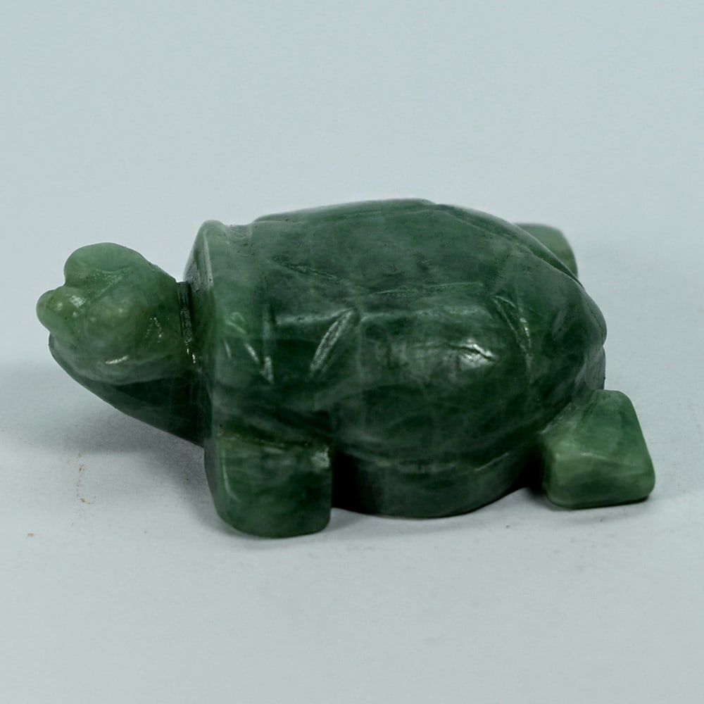 Natural Green Jade 230.05 Ct. Turtle Carving Size 35 x 49 x 16 Mm.: Product ID: 818102426 Product Name: Natural Gemstones Weight: 230.05 CT. Size: 35 x 49 x 16 MM. Shape: Caving Color: multi Color Green Clarity:Opaque Luster: Good Gems Origin: Burma Treatment: Unheate