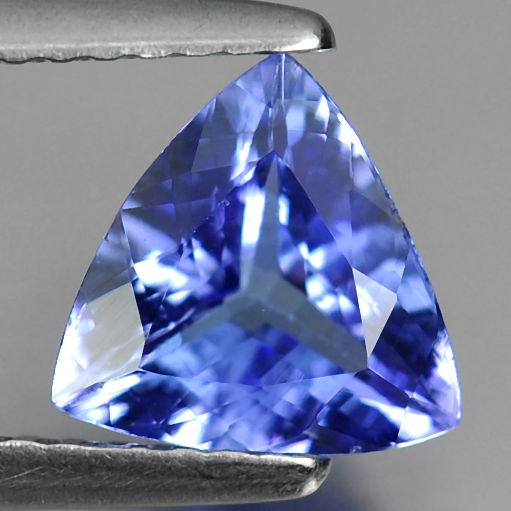 Natural Violetish Blue Tanzanite 1.19 Ct. Trilliant Shape 7.5 x 7.6 Mm. Gemstone From Tanzania: Product ID: 807009404 Product Name: Natural Tanzanite Weight: 1.19 CT. Size: 7.5 x 7.6 x 3.7 MM. Shape: Trilliant Color: Violetish Blue Clarity:VSI Luster: Good Gems Origin: Tanzania Treatment: Heated