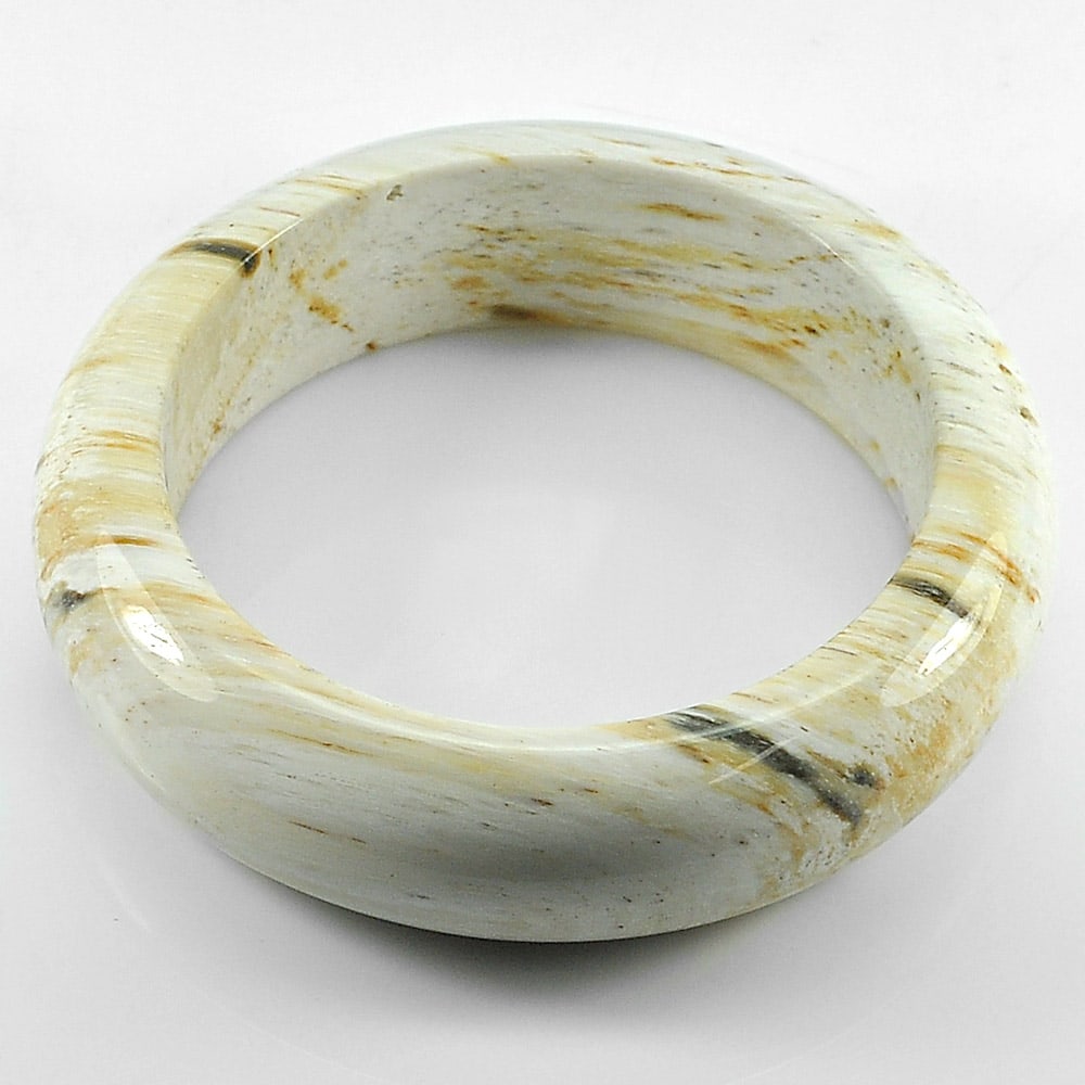 Natural Petrified Wood Unique Pattern Bangle High Quality472.04Ct. Diameter 61 Mm.: Product ID: 819101735 Product Name: Natural Gemstones Weight: 472.04 CT. Size: 80 x 61 x 20 MM. Shape: Round Color: Brown Clarity:Opaque Luster: High Quality Gems Origin: Thailand Treatment: Unheated 