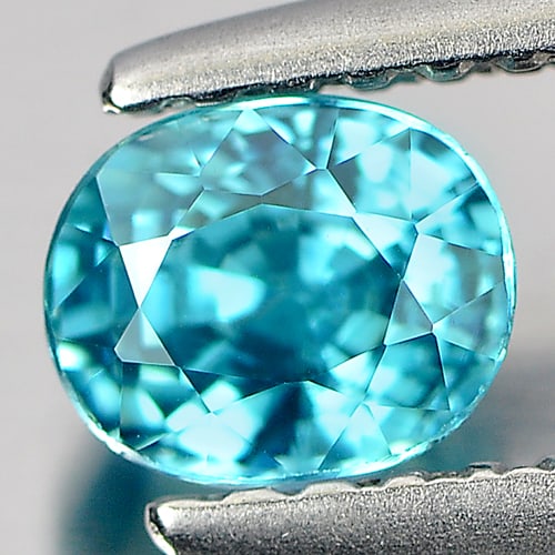 Natural Blue Zircon 0.96 Ct. Clean Oval Shape 5.2 x 4.4 Mm. Gemstone From Cambodia: Product ID: 807713012 Product Name: Natural Zircon Weight: 0.96 CT. Size: 5.2 x 4.4 x 4 MM. Shape: Oval Color: Blue Clarity:IF Luster: Good Gems Origin: Cambodia Treatment: Heated Crystal Structure: T