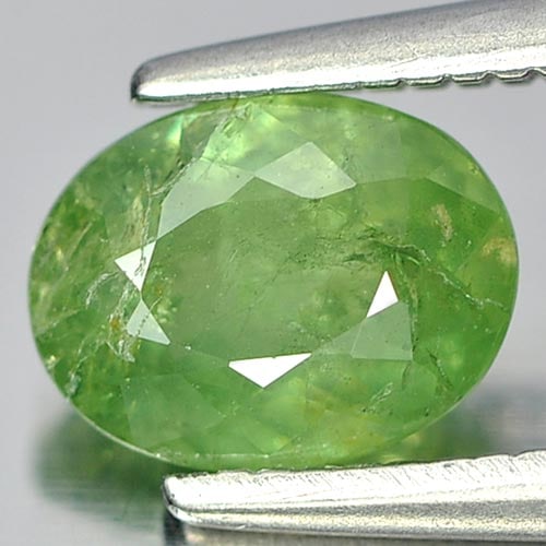 Natural Green Demantoid Garnet 1.06 Ct. Oval Shape 6.8 x 5.2 Mm. Gemstone From Africa: Product ID: 802919206 Product Name: Natural Demantoid Weight: 1.06 CT. Size: 6.8 x 5.2 x 3.2 MM. Shape: Oval Color: Green Clarity:SI Luster: Good Gems Origin: Madagascar , Africa Treatment: Unheated C