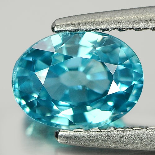Natural Blue Zircon 1.43 Ct. Oval Shape 7 x 5.2 Mm. Gemstone From Cambodia: Product ID: 807710212 Product Name: Natural Zircon Weight: 1.43 CT. Size: 7 x 5.2 x 3.8 MM. Shape: Oval Color: Blue Clarity:VSI Luster: Good Gems Origin: Cambodia Treatment: Heated Crystal Structure: