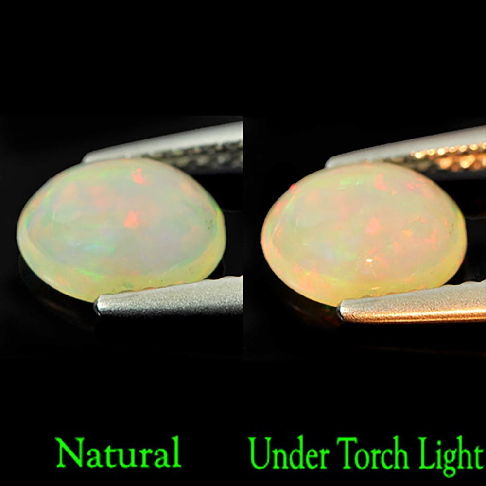 Natural Multi Color Opal 0.77 Ct. Oval Cabochon Shape 7.8 x 6.1 Mm. Unheated Gemstone: Product ID: 818721910 Product Name: Natural Opal Weight: 0.77 CT. Size: 7.8 x 6.1 x 3.4 MM. Shape: Round Diamond Cut Color: Multi Color Clarity:Semi - Transparent Luster: Iridescent Gems Origin: Ethio
