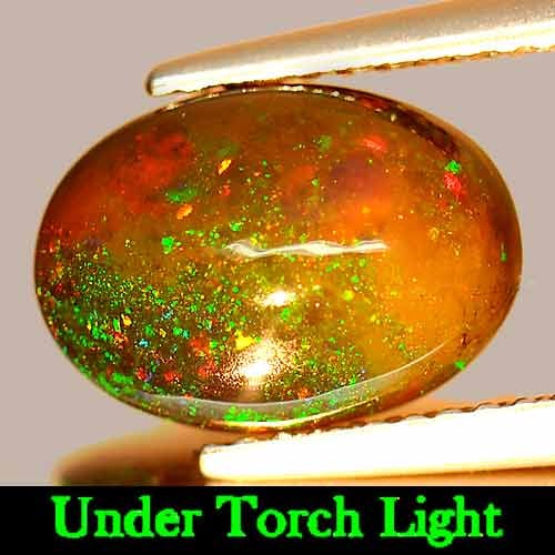 Natural Fire Red Black Opal 1.94 Ct. Oval Cabochon Shape 11.1 x 8 Mm Gemstone From Ethiopia: Product ID: 818725846 Product Name: Natural Opal Weight: 1.94 CT. Size: 11.1 x 8 x 4.7 MM. Shape: Oval Cabochon Color: Multi-Color Clarity:Opaque Luster: Iridescent Gems Origin: Ethiopia Treatment: En
