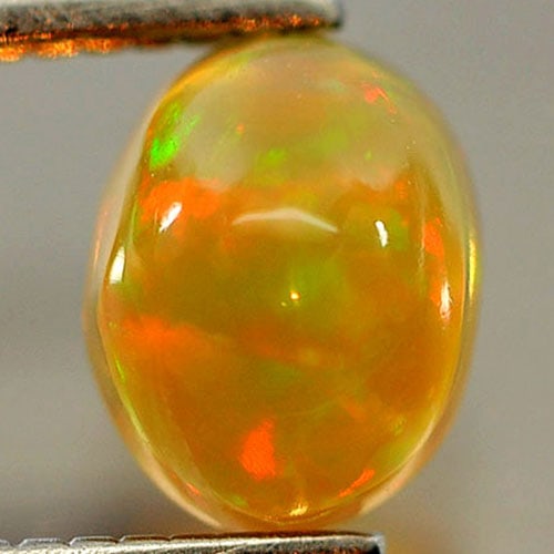 Natural Multi Color Opal 0.46 Ct. Oval Cabochon 6 x 4.6 Mm. Gemstone From Ethiopia: Product ID: 818725930 Product Name: Natural Opal Weight: 0.46 CT. Size: 6 x 4.6 x 3.6 MM. Shape: Oval Cabochon Color: Multi Color Clarity:Opaque Luster: Iridescent Gems Origin: Ethiopia Treatment: Unh