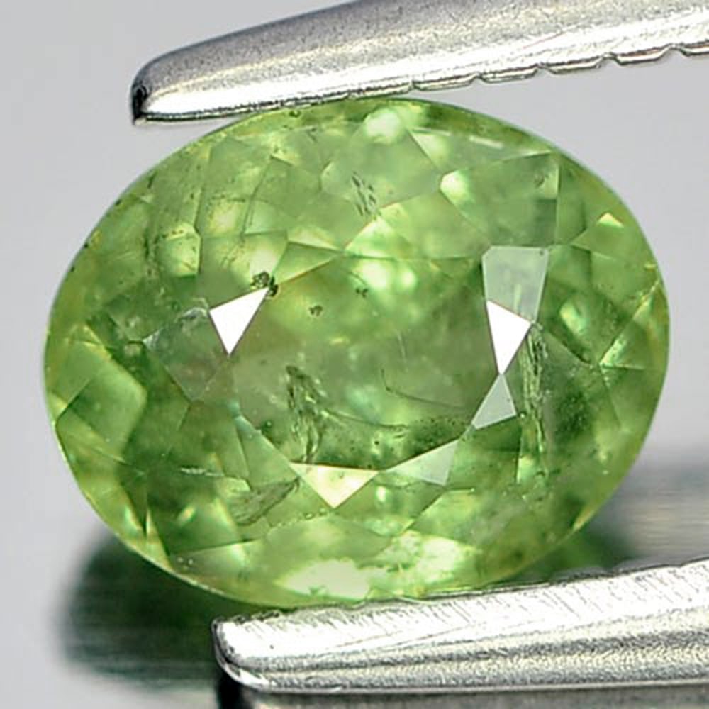 Natural Green Demantoid Garnet 0.72 Ct. Oval Shape 5.8 x 4.7 Mm. Gemstone From Madagascar: Product ID: 802919134 Product Name: Natural Demantoid Weight: 0.72 CT. Size: 5.8 x 4.7 x 3.2 MM. Shape: Oval Color: Green Clarity:SI1 Luster: Good Gems Origin: Madagascar Treatment: Unheated Crystal S