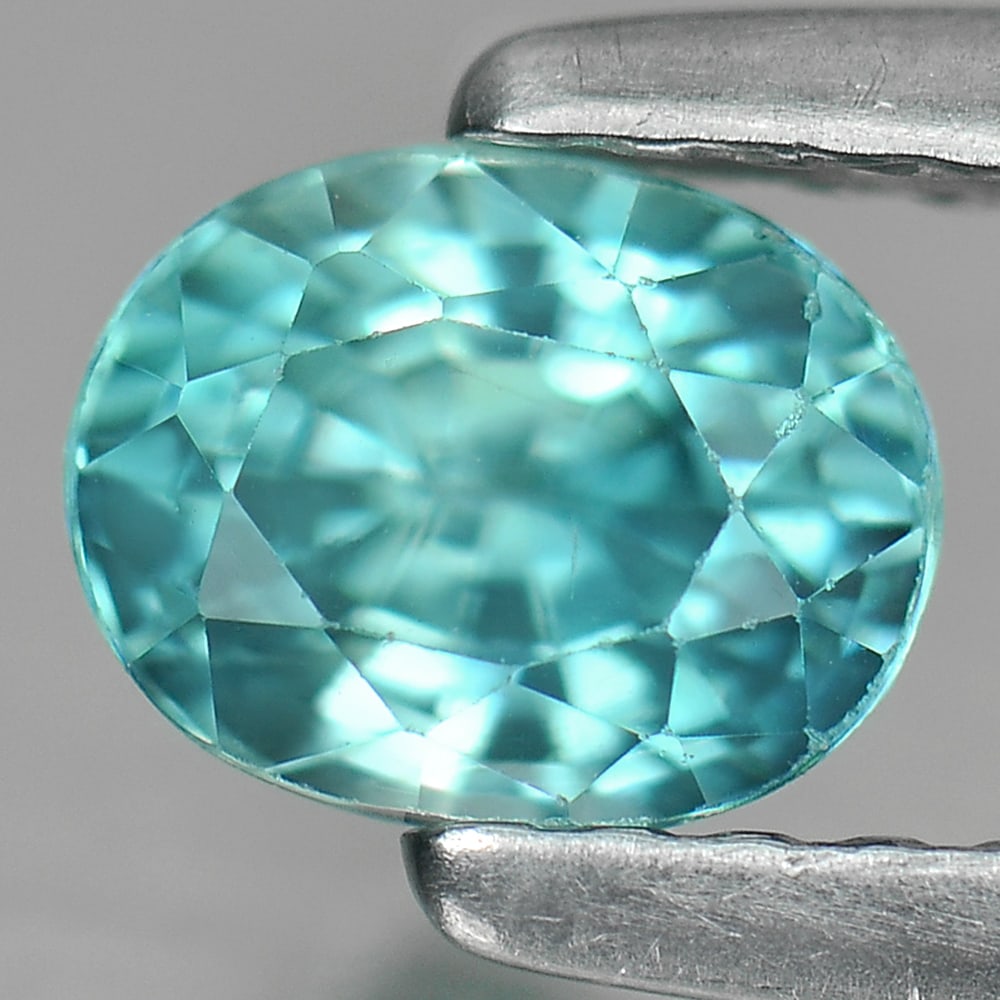Natural Blue Zircon 0.97 Ct. Clean Oval Shape 5.8 x 4.5 Mm. Gemstone From Cambodia: Product ID: 807730770 Product Name: Natural Zircon Weight: 0.97 CT. Size: 5.8 x 4.5 x 3.7 MM. Shape: Oval Color: Blue Clarity:IF Luster: Good Gems Origin: Cambodia Treatment: Heated Crystal Structure: