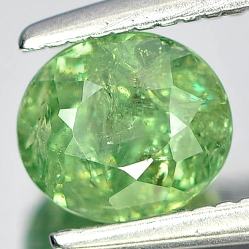 Natural Green Demantoid Garnet 1.04 Ct. Oval Shape 5.7 x 5 Mm Gemstone From Madagascar: Product ID: 802919235 Product Name: Natural Demantoid Weight: 1.04 CT. Size: 5.7 x 5 x 4.2 MM. Shape: Oval Color: Green Clarity:SI Luster: Good Gems Origin: Madagascar , Africa Treatment: Unheated Cry