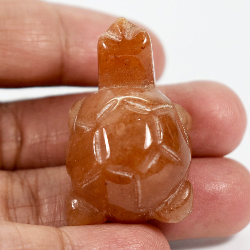 Natural Honey Jade 84.71 Ct. Turtle Carving Size 22 x 35 x 17 Mm.: Product ID: 818102501 Product Name: Natural Gemstones Weight: 84.15 CT. Size: 22 x 35 x 17 MM. Shape: Caving Color: brown Honey Clarity:Opaque Luster: Good Gems Origin: Burma Treatment: Unheated Cryst