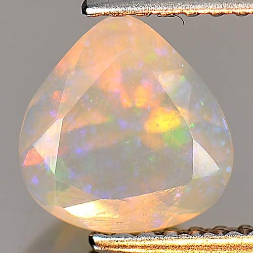 Natural Multi Color Opal 0.71 Ct. Pear Shape 7.6 x 7.4 Mm. Gemstone Unheated: Product ID: 818726131 Product Name: Natural Opal Weight: 0.71 CT. Size: 7.6 x 7.4 x 4.2 MM. Shape: Pear Color: Multi Color Clarity:Semi - Transparent Luster: Iridescent Gems Origin: Ethiopia Treatment