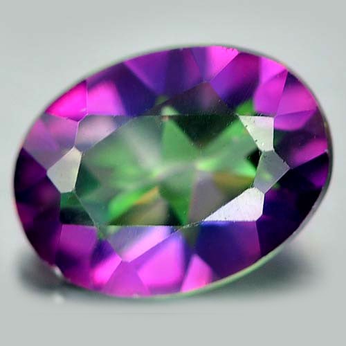 Natural Mystic Green Topaz 1.44 Ct. VS Oval Shape 8.1 x 6.1 Mm. Gemstone From Brazil: Product ID: 807160395 Product Name: Natural Topaz Weight: 1.44 CT. Size: 8.1 x 6.1 x 3.8 MM. Shape: Oval Color: Mystic Clarity:VS Luster: Good Gems Origin: Brazil Treatment: Treated Crystal Structure: