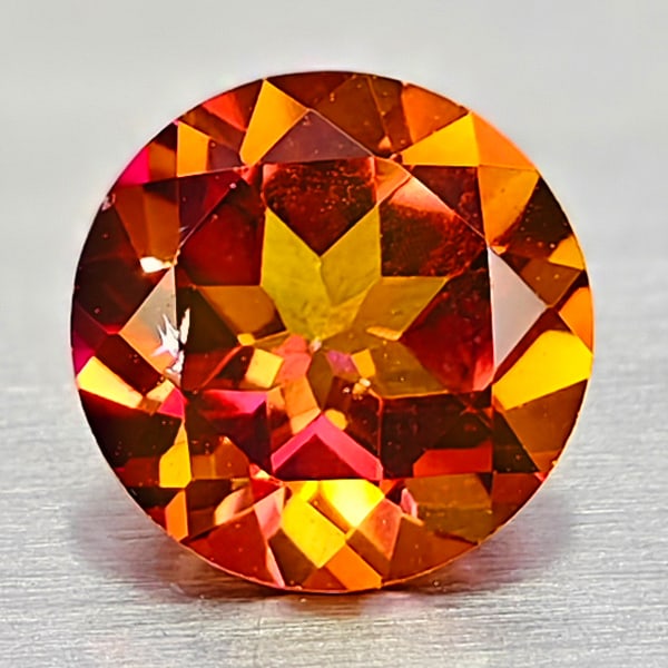 Natural Cracking Fire Color Topaz 0.91 Ct. Round Shape 6.1 Mm Gemstone From Brazil: Product ID: 807167847 Product Name: Natural Topaz Weight: 0.91 CT. Size: 6.1 x 6.1 x 3.7 MM. Shape: Round Color: Cracking Fire Clarity:IF Luster: Very Good Gems Origin: Brazil Treatment: Treated Cryst