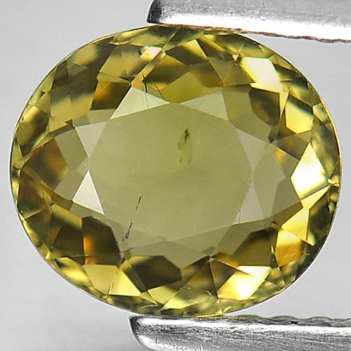 Natural Lime Yellow Tourmaline 1.28 Ct. Oval Shape 7.7 x 7 Mm Gemstone From Nigeria: Product ID: 807229128 Product Name: Natural Tourmaline Weight: 1.28 CT. Size: 7.7 x 7 x 3.5 MM. Shape: Oval Color: Lime Yellow Clarity:VSI Luster: Good Gems Origin: Nigeria Treatment: Unheated Crystal