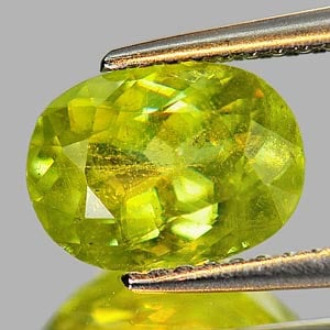 Natural Intense Yellowish Green With Rainbow Spark Sphene 1.93 Ct. Oval Shape 9.1 x 6.8 Mm Gemstone: Product ID: 806506011 Product Name: Natural Sphene Weight: 1.93 CT. Size: 9.1 x 6.8 x 4.4 MM. Shape: Oval Color: Yellowish Green With Rainbow Clarity:SI1 Luster: Adamantine Gems Origin: Madagascar Tre