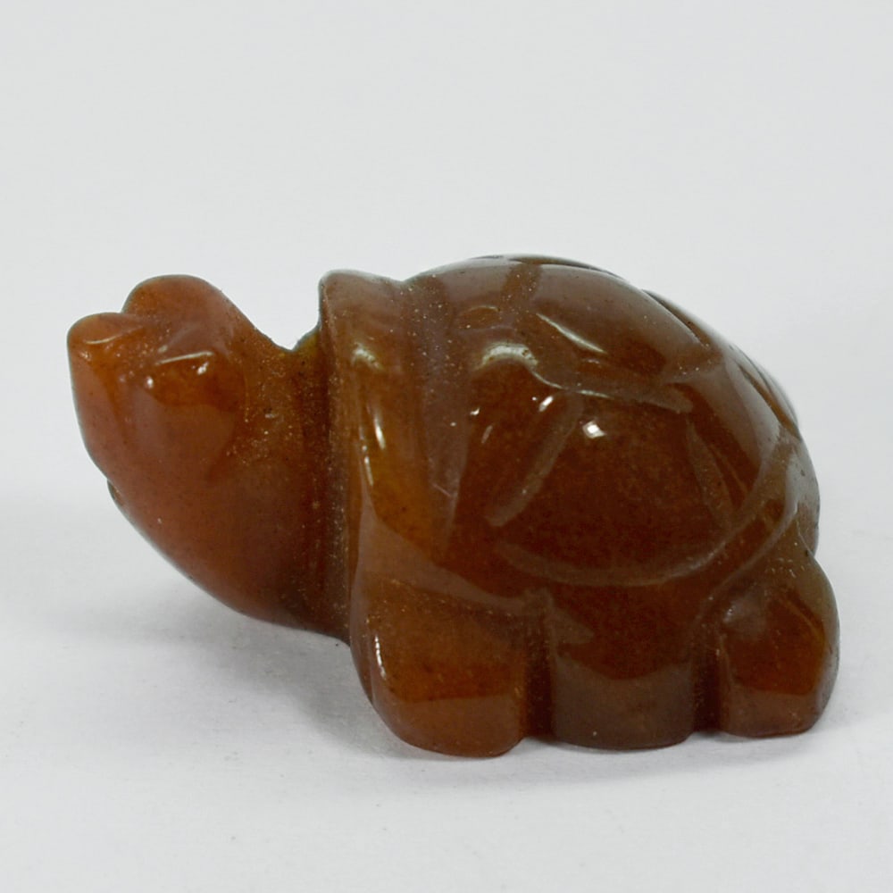 Natural Honey Jade 114.36 Ct. Turtle Carving Size 28 x 38 x 20 Mm.: Product ID: 818102415 Product Name: Natural Gemstones Weight: 114.36 CT. Size: 28 x 38 x 20 MM. Shape: Caving Color: multi Color brown Honey Clarity:Opaque Luster: Good Gems Origin: Burma Treatment: U