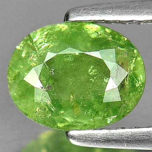 Natural Green Demantoid Garnet 1.35 Ct. Oval Shape 7.8 x 6.1 Mm Gemstone From Madagascar: Product ID: 802919311 Product Name: Natural Demantoid Weight: 1.35 CT. Size: 7.8 x 6.1 x 3.3 MM. Shape: Oval Color: Green Clarity:SI1 Luster: Good Gems Origin: Madagascar , Africa Treatment: Unheated 