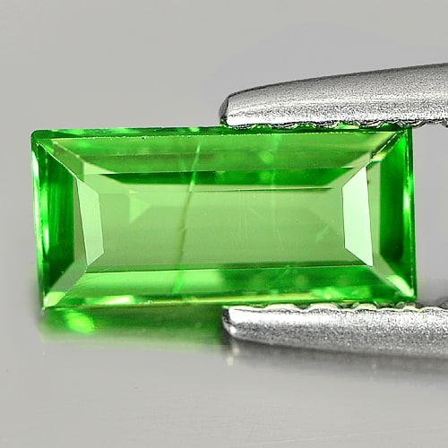 Natural Green Tsavorite Garnet 0.58 Ct. Baguette Shape 7.5 x 3.7 Mm. Gemstone From Tanzania: Product ID: 803000923 Product Name: Natural Tsavorite Weight: 0.58 CT. Size: 7.5 x 3.7 x 1.8 MM. Shape: Baguette Color: Green Clarity:VSI Luster: Good Gems Origin: Tanzania Treatment: Unheated Crystal